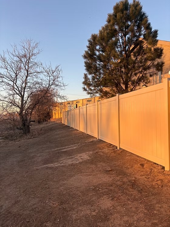 Tan commercial vinyl privacy fence installation serving Bellevue and Sarpy County Tan commercial vinyl privacy fence installation serving Bellevue and Sarpy County