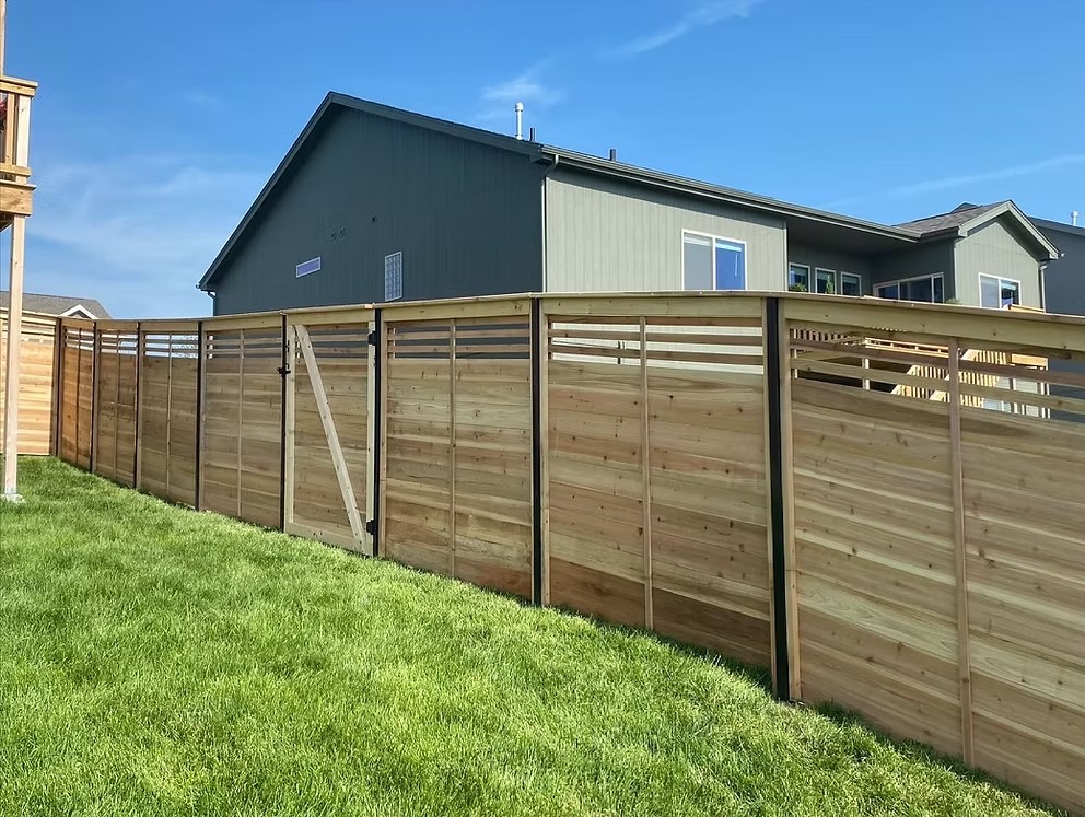 Fence contractor Bellevue, NE — Taylormade Fence LLC Modern horizontal wood privacy fence in Bellevue, NE by fence contractor Taylormade Fence LLC