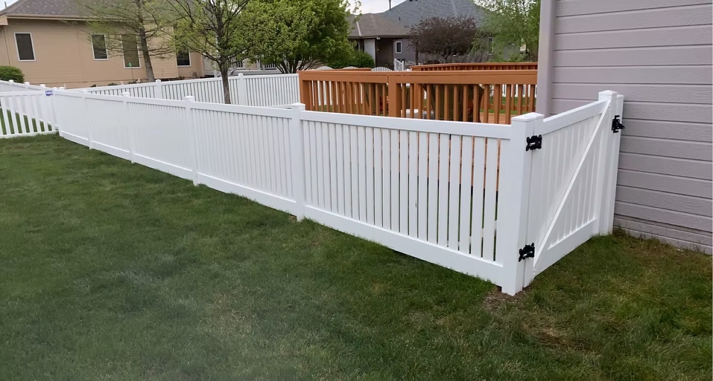 White vinyl fence with gate and black hardware installed in Bellevue, NE White vinyl fence with gate and black hardware installed in Bellevue, NE